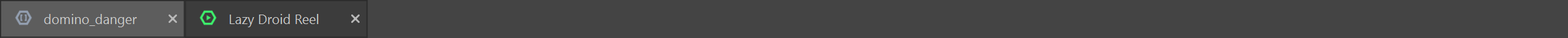 The tab strip under the menu bar with two tabs, domino_danger with a film icon and Lazy Droid Reel with a reel icon, each with a close button.